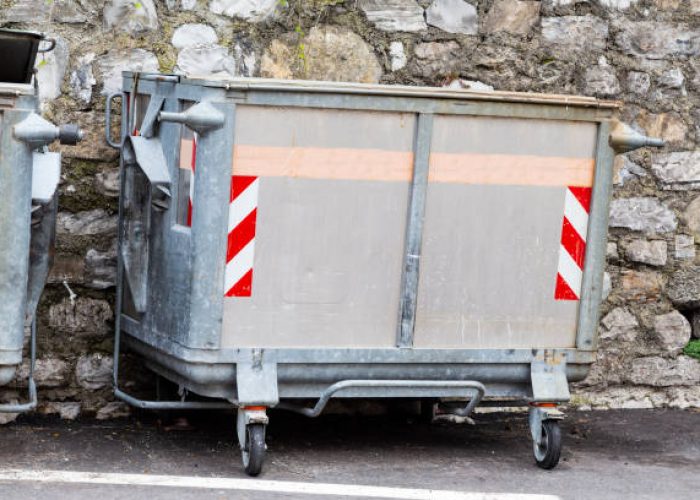 dump garbage bin on street near concret wall for waste in europe